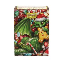 Accessoires The 2024 Dragon Shield Christmas Brushed Art sleeves feature mischevious dragons endulging in seasonal sweets. Brushed Art sleeves feature a lightly textured back and provide a steady shuffle-feel as you face off against your opponents. Art sl