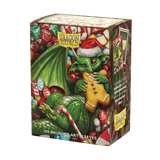 The 2024 Dragon Shield Christmas Brushed Art sleeves feature mischevious dragons endulging in seasonal sweets. Brushed Art sleeves feature a lightly textured back and provide a steady shuffle-feel as you face off against your opponents. Art sleeves are pr