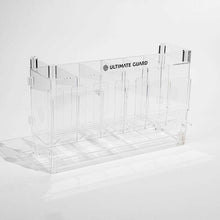 Accessoires Stackable and expandable dispenser for trading card booster packs, deck boxes and more. With high-quality 100% acrylic panels, 6 compartments and front slots for displaying booster packs and a top shelf for displaying accessories.- High qualit