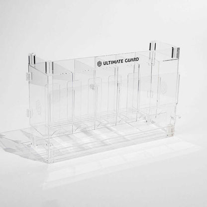 Accessoires Stackable and expandable dispenser for trading card booster packs, deck boxes and more. With high-quality 100% acrylic panels, 6 compartments and front slots for displaying booster packs and a top shelf for displaying accessories.- High qualit