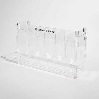 Accessoires Stackable and expandable dispenser for trading card booster packs, deck boxes and more. With high-quality 100% acrylic panels, 6 compartments and front slots for displaying booster packs and a top shelf for displaying accessories.- High qualit