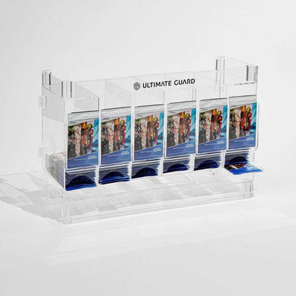 Accessoires Stackable and expandable dispenser for trading card booster packs, deck boxes and more. With high-quality 100% acrylic panels, 6 compartments and front slots for displaying booster packs and a top shelf for displaying accessories.- High qualit